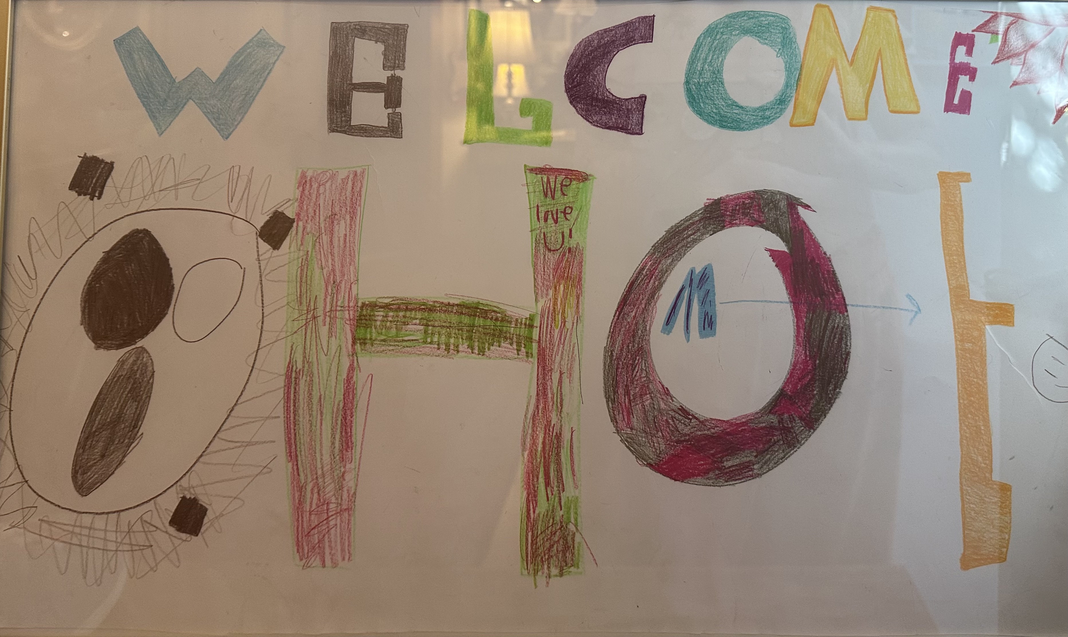 Welcome Home — colorful hand-drawn sign